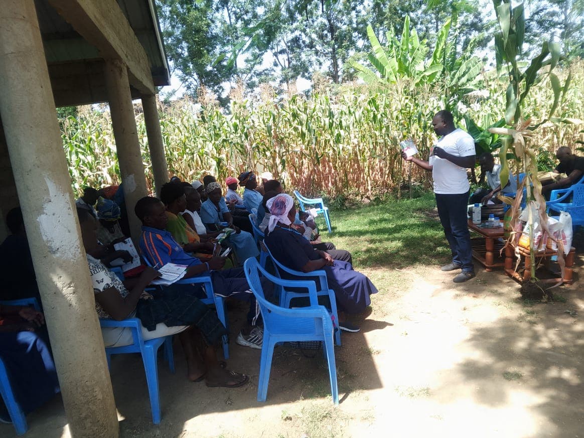 Farmers participating in an interactive classroom discussion about crop management